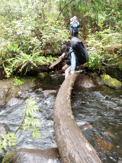 hiking Vancouver Island North Coast Trail crossing a creek
